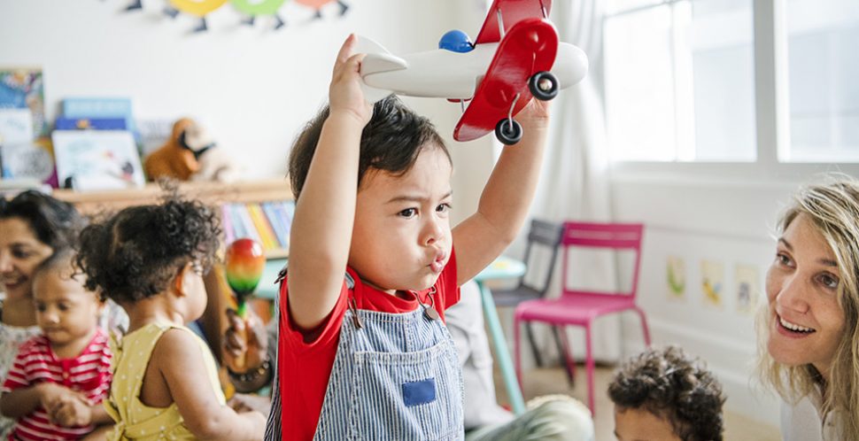 A child in day care plays with a toy | After decades of advocacy, the provincial and federal governments have announced an investment of $3.2 billion over five years in quality, universal and affordable childcare